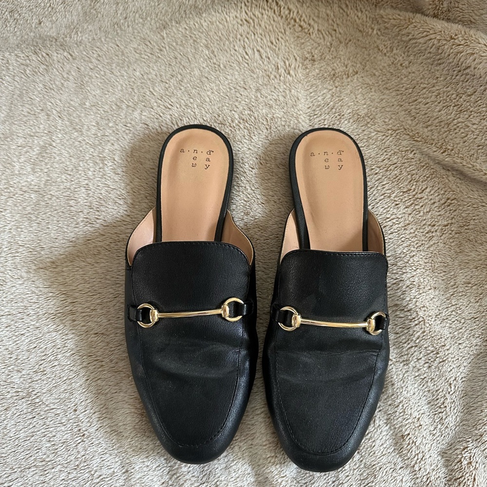 Black flats with gold accent